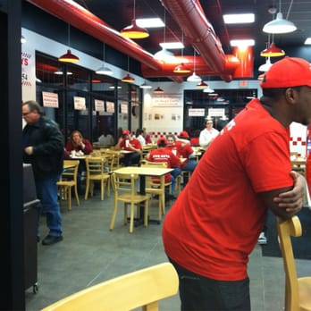 Five Guys - 7 guys eating... that's 17 guys at five guys! This place is operating at 3x staffage!! Glad they're having fun :-) - Burgers Near Me - Shelton, Connecticut