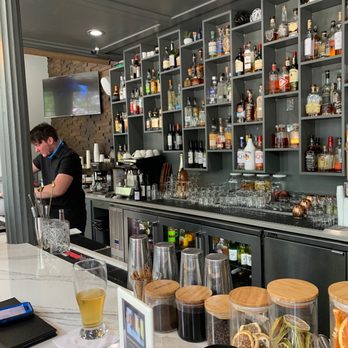 Tandem Coffee and Spirits - a man behind the bar - Cocktail Bars Near Me - Savannah, Georgia Tandem Coffee and Spirits - a man behind the bar - Cocktail Bars Near Me - Savannah, Georgia