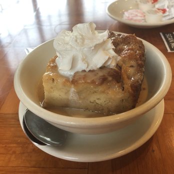 Chef Roy's Frog City Cafe - a bowl of bread pudding with whipped cream - Cajun/Creole Near Me - Rayne, Louisiana Chef Roy's Frog City Cafe - a bowl of bread pudding with whipped cream - Cajun/Creole Near Me - Rayne, Louisiana
