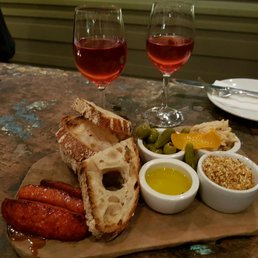Small mezze board with glasses of rosé Small mezze board with glasses of rosé