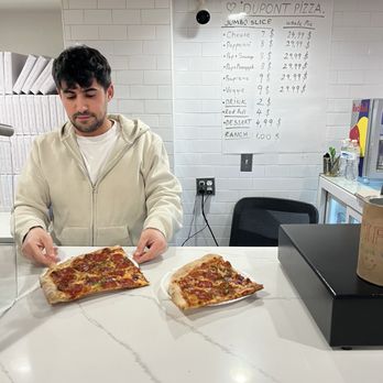 Dupont Pizza - The guy behind the counter and our HUGE SLICE of pizza. One for me and one for my husband. - Pizza Near Me - Washington, DC, District of Columbia