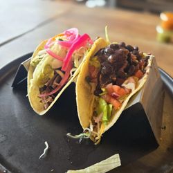 Las Fridas Mexican Kitchen - 1 veggie taco on corn tortilla and 1 sagrada (brisket) taco on corn tortilla