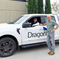 Dragonfly Heating, Cooling & Plumbing - Father & son Austin Green (General Manager, Left) and Will Green (Owner, Right) posed in front of a Dragonfly HCP service van.