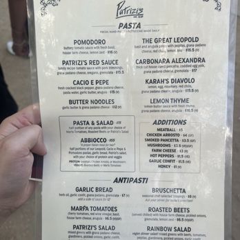 Patrizi's - A printed menu from Patrizi's pasta food truck in Austin, TX, listing pasta options like Pomodoro, Patizi's Red Sauce, and salads, with prices and ingredients. - Italian Near Me - Austin, Texas