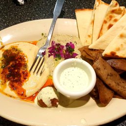 Gyro platter (#2) with hummus and babaganoush and one additional falafel. Gyro platter (#2) with hummus and babaganoush and one additional falafel.
