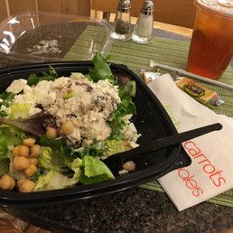 a salad and a drink on a table a salad and a drink on a table