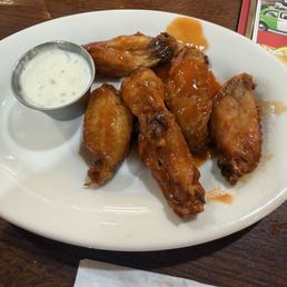 Tiny wings with hot sauce dumped over them.