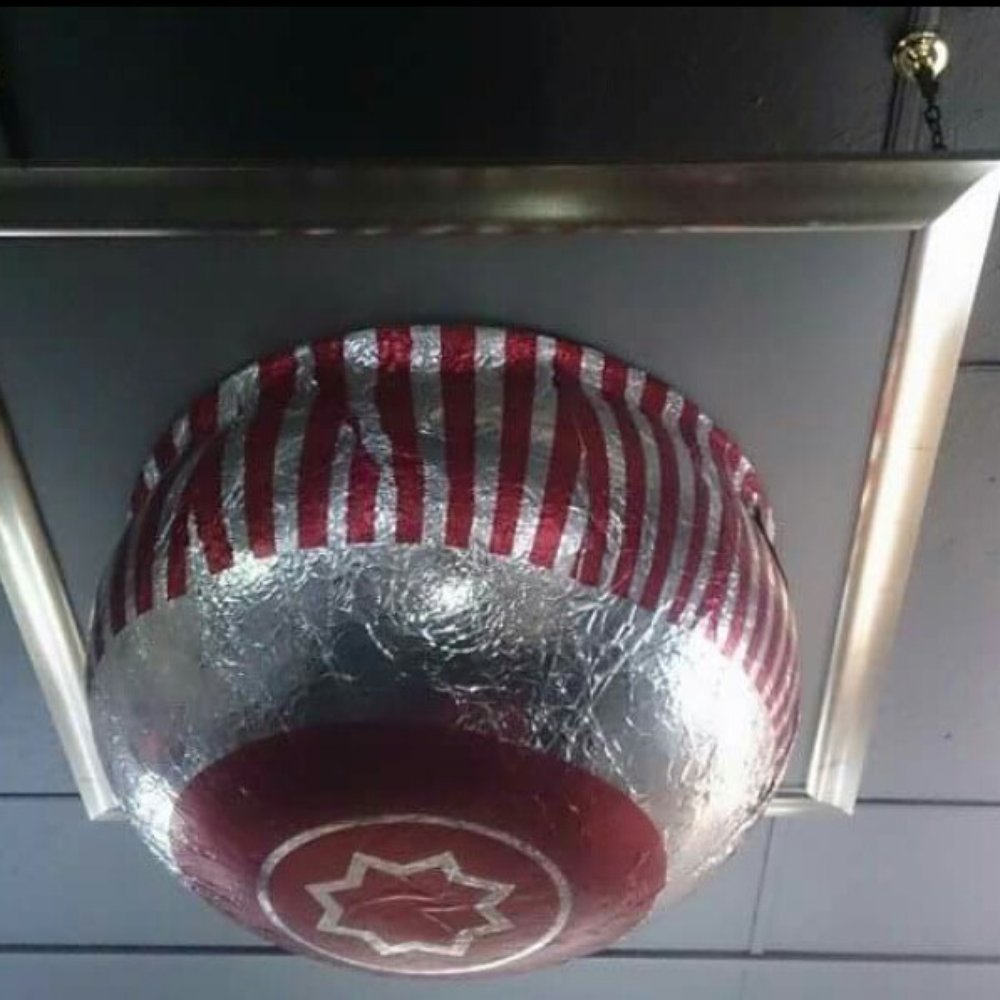 The Framing Workshop - Giant tunnocks tea cake from the opening ceremony of the commonwealth games framed and on the roof. - Framing Near Me - Glasgow, GLG