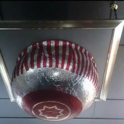 The Framing Workshop - Giant tunnocks tea cake from the opening ceremony of the commonwealth games framed and on the roof.