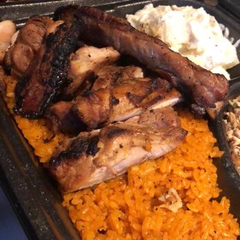 Red Rice - Hafa Adai plate, empanada, and red rice spam musubi - Barbeque Near Me - Las Vegas, Nevada
