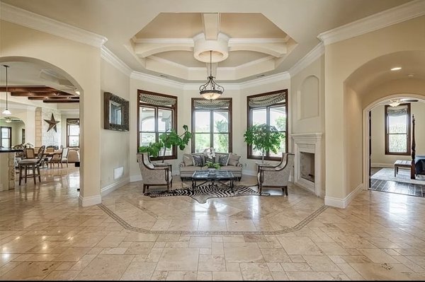 Design Build Lakeway Flintrock Rd. 3500 Sq Ft custom stone tile - New Construction In Lakeway. We developed and subdivided a 20 acre tract into 20 lots and annexed into the City of Lakeway Texas. Designed by Cash and built with 8000 +/- sq. ft. under roof "Flint rock" included 4000 square feet of a custom marble 4 piece pattern tile mosaic flooring.  Within the giant  marble mosaic throughout the main space we created seamless pattern changes to match the ceiling elevations which were unique to every room. Hand hewed solid Douglas Fur Beams, stone double sided fireplace, 8x10 walk in shower with body sprayers, 2 half and 5 full Bathrooms, 2 Master suites, elevator shaft that opened into upstairs master, and a chefs kitchen.