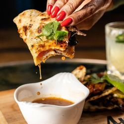 Amorous Tacos - Try our Birria. The flava is in the drip.