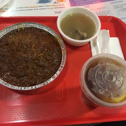 Cheese bolognese spaghetti (芝士焗肉醬意粉) with a soup and cold lemon tea. Question: where is the cheese? Cheese bolognese spaghetti (芝士焗肉醬意粉) with a soup and cold lemon tea. Question: where is the cheese?