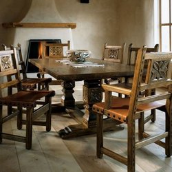 Southwest Spanish Craftsmen - The El Rey dining set features beautiful hand-carved floral details on the chairs an pedestal table base.