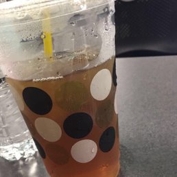 a cold beverage in a plastic cup