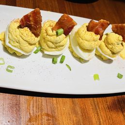 Deviled eggs with candied bacon. Delicious!