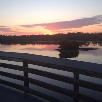 Robinson Preserve - View of the rising sun coming up over the channel at the South Bridge - looking to the East, of course. - Parks Near Me - Bradenton, Florida