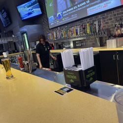 Buffalo Wild Wings - Bar seating and giant tv screen.