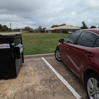 Krispy Krunchy Chicken - This space between my car and empty dumpster with a funeral home view was the perfect spot to complete my Mission - American Near Me - Greenville, Texas