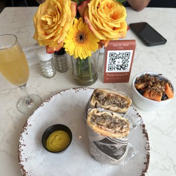 Buen Vecino Café - Bistec sándwich with a side of fruit and a mimosa - Coffee & Tea Near Me - San Juan, Puerto Rico