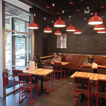 CityBird - two people sitting at tables in a restaurant - Chicken Shop Near Me - Chicago, Illinois