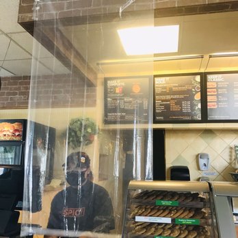 Subway - a man standing behind a counter in a donut shop - Sandwiches Near Me - Buttonwillow, California
