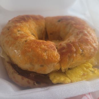 Twisted Biscuit Cafe - JALAPENO BAGEL BREAKFAST SANDWICH: Jalapeno cheese bagel with pepper jack cheese, egg, and sausage. - Breakfast & Brunch Near Me - Palm Bay, Florida Twisted Biscuit Cafe - JALAPENO BAGEL BREAKFAST SANDWICH: Jalapeno cheese bagel with pepper jack cheese, egg, and sausage. - Breakfast & Brunch Near Me - Palm Bay, Florida