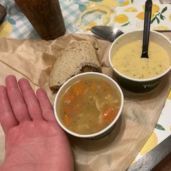 Panera Bread - Tiny cups of soup for $7-$8 and half of a cheese steak sandwich for $9. My hand is for size comparison. Not worth it.