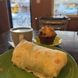 Breakfast burrito, morning breakfast muffin with bacon and blueberry. Breakfast burrito, morning breakfast muffin with bacon and blueberry.
