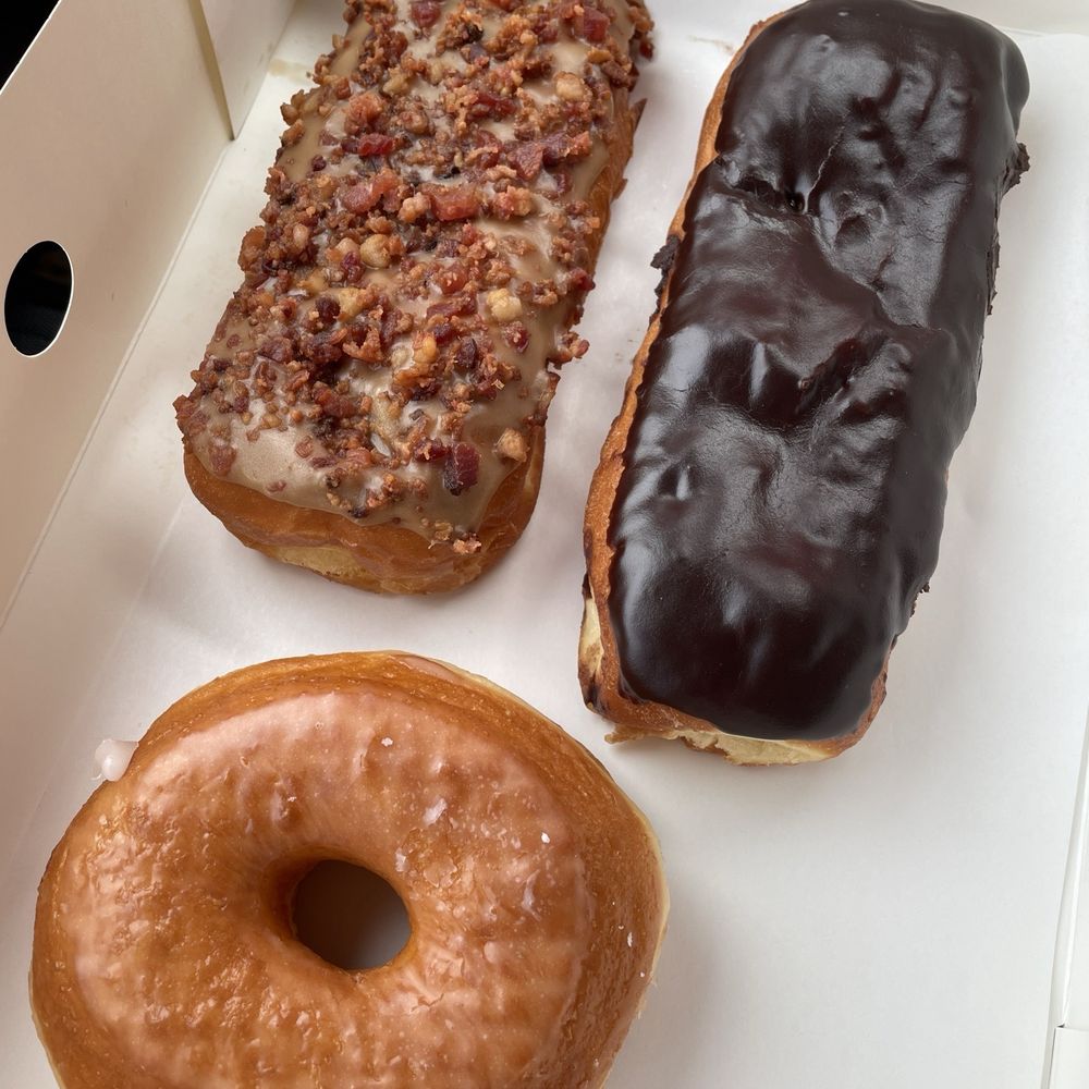 Original glazed, maple long john with bacon, and chocolate long john