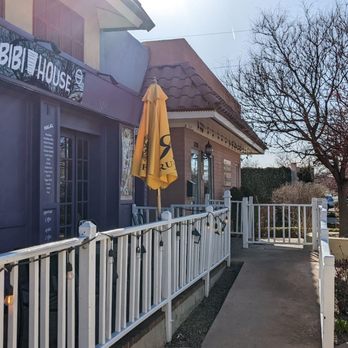 Arabian Nights Bistro - Ramp to front entrance and a garden area to the right separates the restaurant from the street - Mediterranean Near Me - Albuquerque, New Mexico