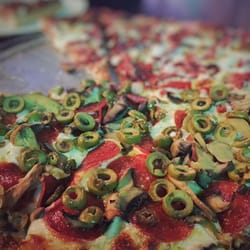Buffalo Alice - Plenty of toppings on the pizzas. Medium thickness crust with a slight crunch. Delicious!