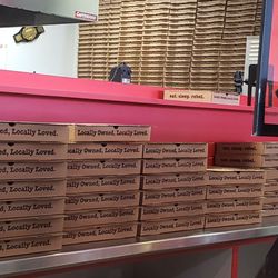 HotBox Pizza - A wall of pizza boxes ready to go!