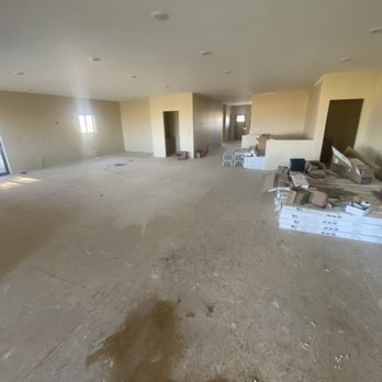S & T Quality Construction - Main entrance, living room, kitchen and dining area before hardwood install - Flooring Near Me - Helena, Montana S & T Quality Construction - Main entrance, living room, kitchen and dining area before hardwood install - Flooring Near Me - Helena, Montana