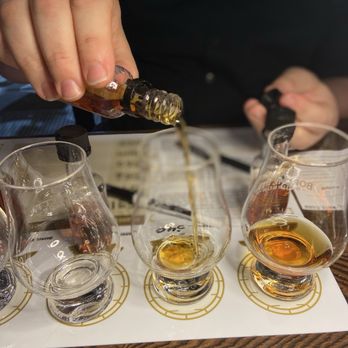 Big Machine Brewery & Distillery - Pouring the bourbons into their specially-made glasses so you can get the most from your senses when smelling & tasting. - Distilleries Near Me - Nashville, Tennessee Big Machine Brewery & Distillery - Pouring the bourbons into their specially-made glasses so you can get the most from your senses when smelling & tasting. - Distilleries Near Me - Nashville, Tennessee