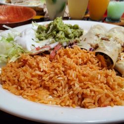 El Tajin Mexican Restaurant - Triple chicken enchiladas, rice, guacamole, Pico and sour cream
