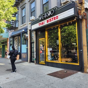 A Gusto Thai Bistro - a woman walking down the sidewalk - Cafes Near Me - Brooklyn, New York A Gusto Thai Bistro - a woman walking down the sidewalk - Cafes Near Me - Brooklyn, New York