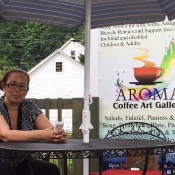 Aroma Coffee Art Gallery - Anat, Owner of Aroma Coffee Art Gallery waiting to greet guests. - Coffee & Tea Near Me - Hammondsport, New York