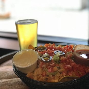 Huskies Tavern - a plate of food and a glass of beer - American Near Me - Storrs, Connecticut Huskies Tavern - a plate of food and a glass of beer - American Near Me - Storrs, Connecticut