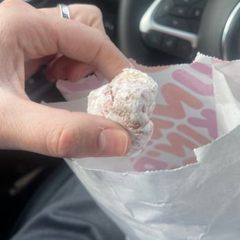Dunkin' - a person holding a donut in a bag - Donuts Near Me - Wakefield, Massachusetts Dunkin' - a person holding a donut in a bag - Donuts Near Me - Wakefield, Massachusetts