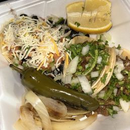 2 tacos veggie(left), 2 tacos carne asada 2 tacos veggie(left), 2 tacos carne asada