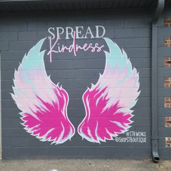 ST Boutique - Side wall mural, have your pic taken in front!