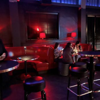 Gimme Gimme - a group of people sitting at a bar - Bars Near Me - San Antonio, Texas