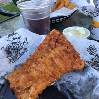 The Wharf - One batter fried fish fillet. The basket came with two and a side. - Burgers Near Me - Crosslake, Minnesota The Wharf - One batter fried fish fillet. The basket came with two and a side. - Burgers Near Me - Crosslake, Minnesota