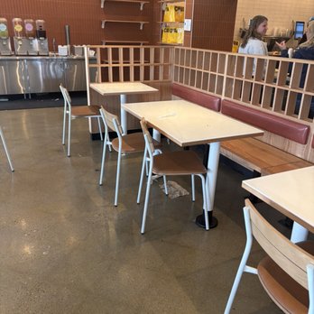 CAVA - Dirty tables throughout, trash on the floor- including a dirty rubber glove - Mediterranean Near Me - Novi, Michigan