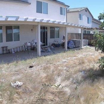 TRINITY LAWN CARE - This is before the cleanup on the backyard left side. - Gardeners Near Me