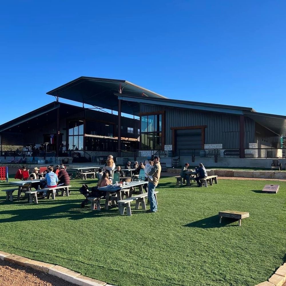 Iron Wolf Ranch and Distillery - Distillery, part of the outdoor seating and games - Distilleries Near Me - Spicewood, Texas Iron Wolf Ranch and Distillery - Distillery, part of the outdoor seating and games - Distilleries Near Me - Spicewood, Texas