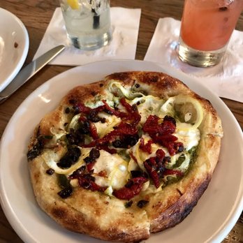 AOC - Focaccia - arugula pesto, goat cheese, lemon, sun dried tomatoes (HH: $12) - Cocktail Bars Near Me - Los Angeles, California