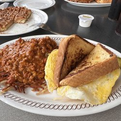 Waffle House - Bacon, egg and cheese melt with hashbrowns covered in chili and chunks of ham