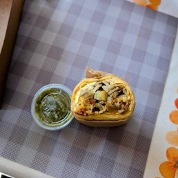 Burrito ? Very small burrito, a side of salsa for size comparison. So much extra tortilla. Their burrito ads are misleading.